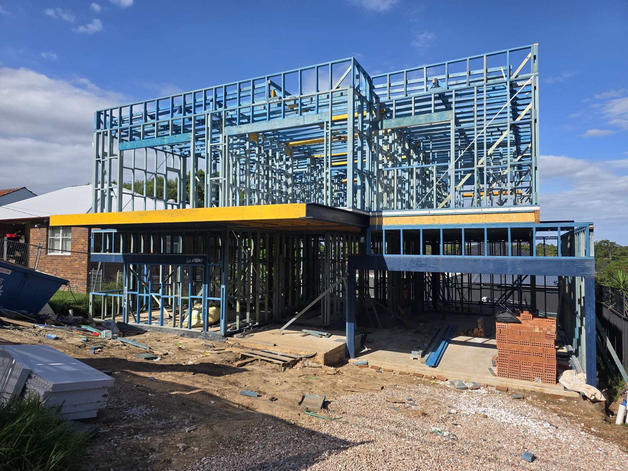 Two-storey steel framed duplex with structural steel beams and LVL over the ground floor